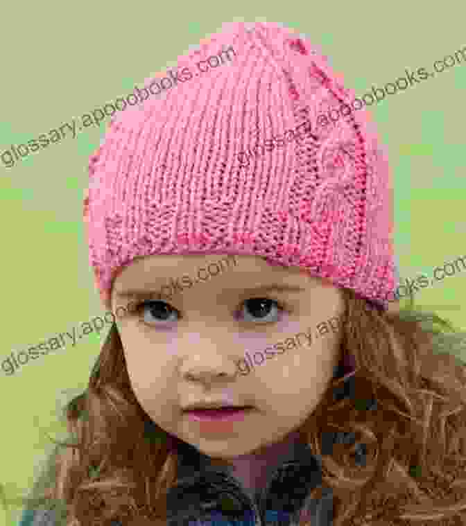 Ssk Baby Cable Pattern Hat In Vibrant Pink Yarn, Topped With A Playful Pompom SSK Baby S Cable Pattern Hat